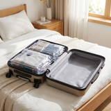 Open suitcase packed with Eluqo vacuum compression bags